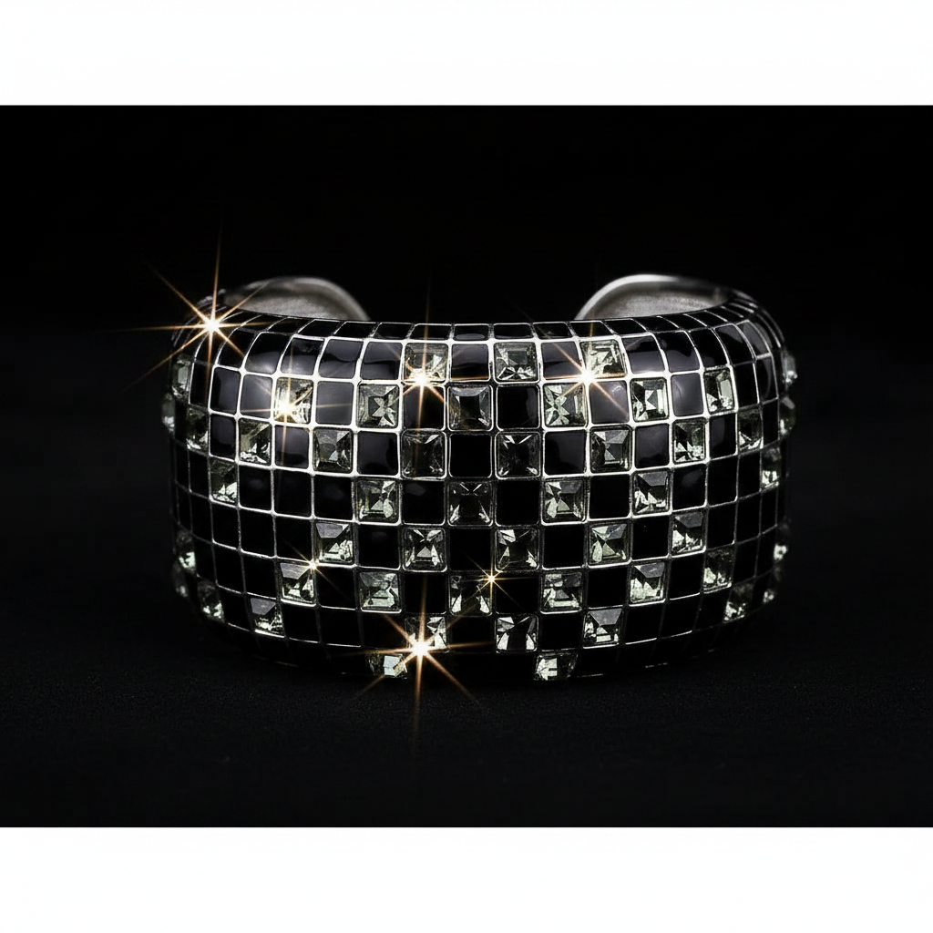 Black and silver checkered bracelet with sparkling stones on a black background