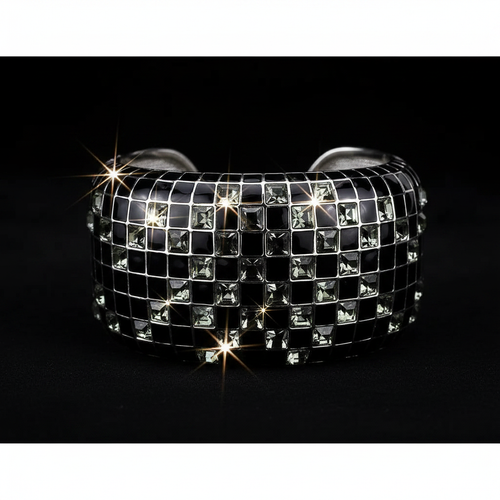 Black and silver checkered bracelet with sparkling stones on a black background